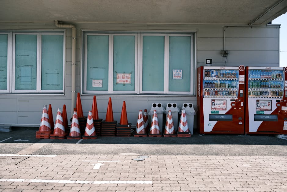 Street view of Gamagōri, Japan showcasing vending machines and neatly arranged traffic cones.